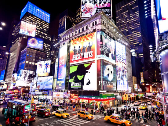 Times Square at night during your 4 days in New York