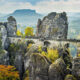 Bastei Bridge seems to float among the rock spires high above the trees.