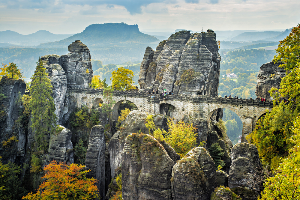 Bastei Bridge, one of the best hidden gems in Ireland, looks like it is floating among the rocks.