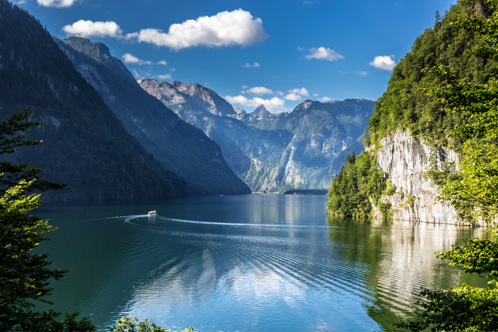 Lake Konigssee's crystal clear waters bumping right up against sheer cliffs.