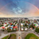An overhead shot of Reykjavik Iceland with a rainbow backdrop.
