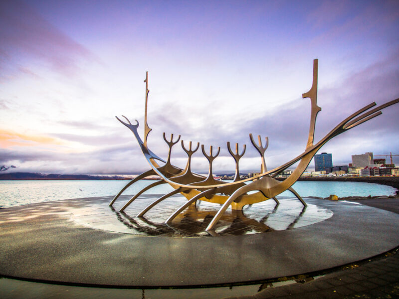 The Sun Voyager statue sits against a periwinkle sky. 