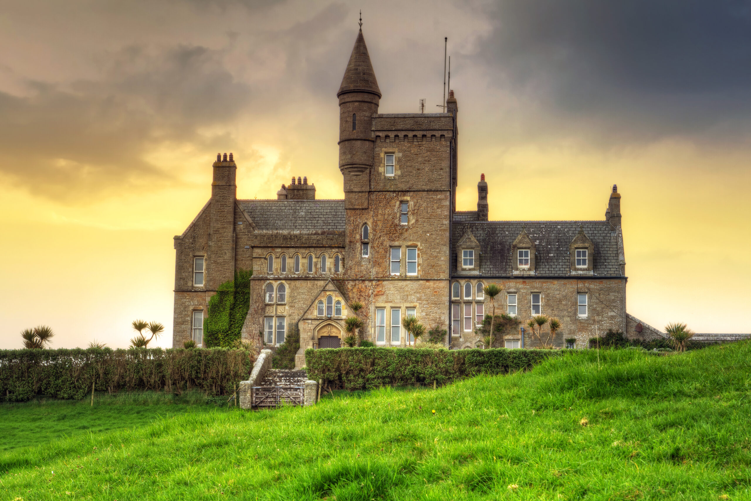 Golden sunset view of Classiebawn Castle.