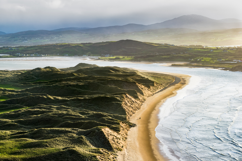 Aerial view of Five Finger Strand Beach at golden hour.