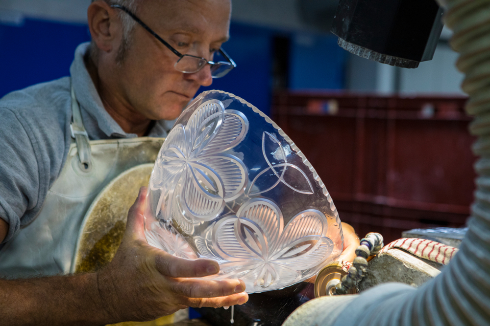 Craftsman working on a intricate Waterford crystal.