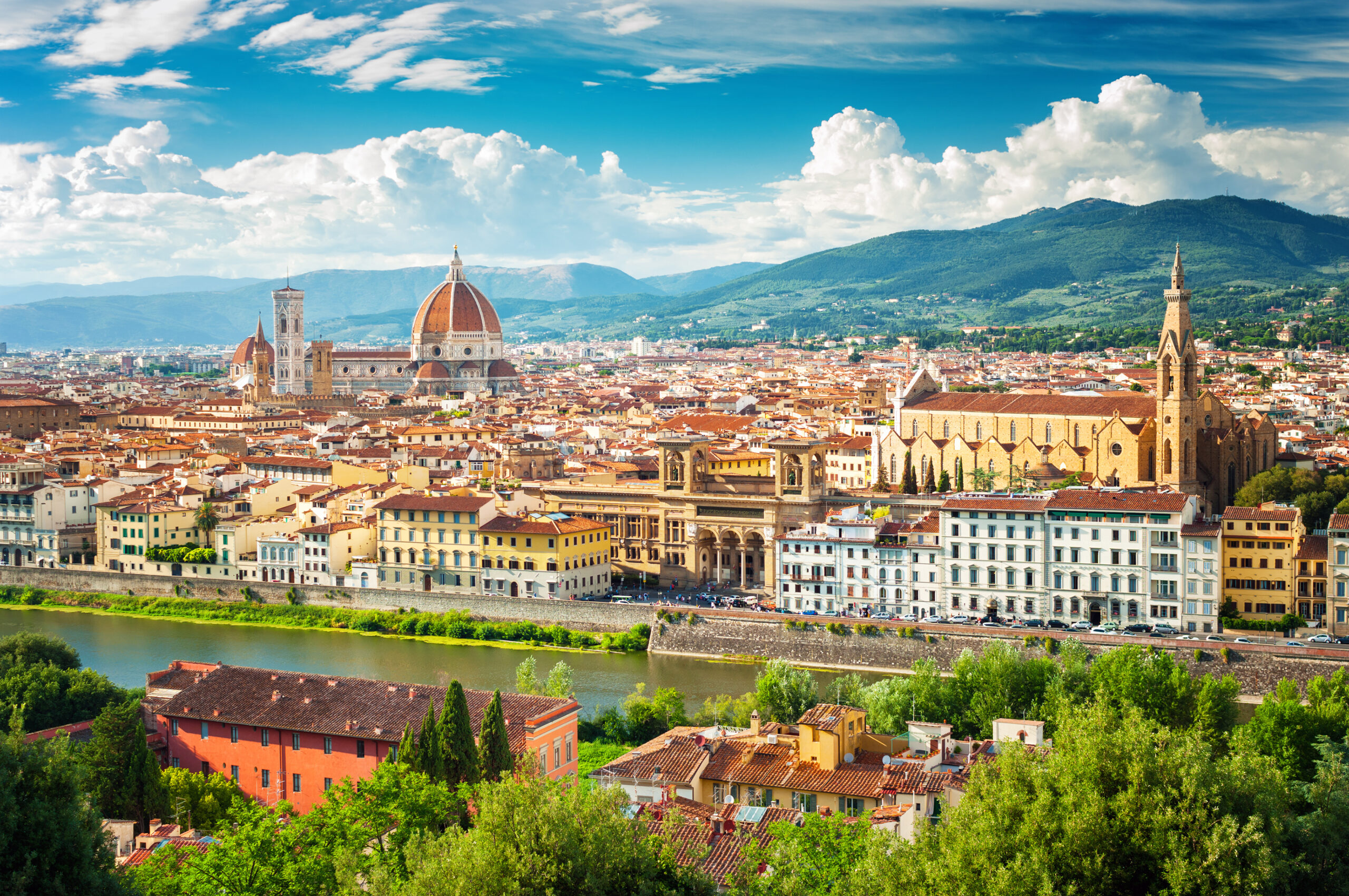 Photo of Florence (Firenze) cityscape, Italy. Featuring city of Florence with many buildings including a church. 