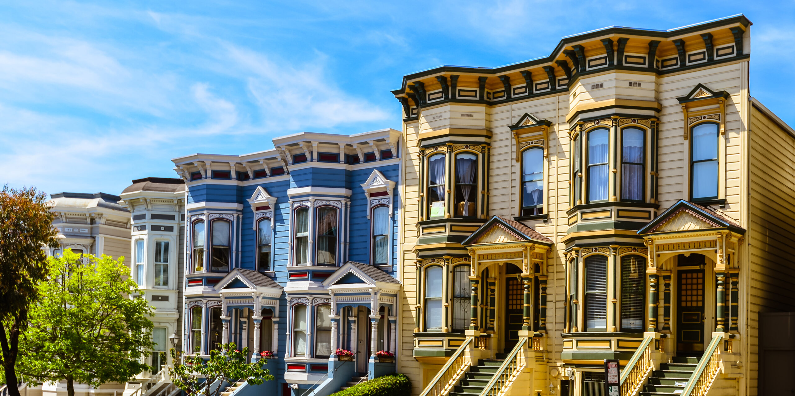 Photo of Haight and Ashbury neighborhood featuring quintessential Victorian homes. 