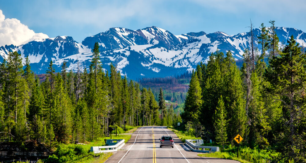 Photo of car driving in Yellowstone.