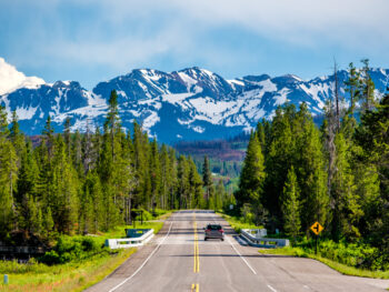 Photo of car driving in Yellowstone.