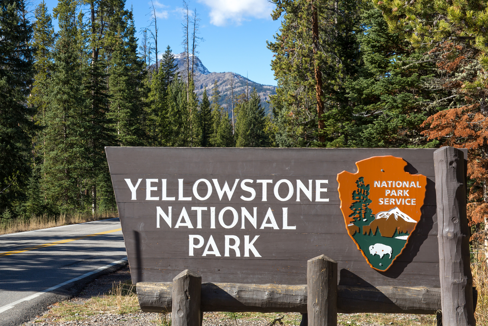 Photo of park sign announcing your Yellowstone road trip