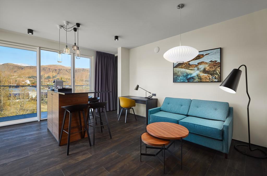 Photo of living room in guest room at Hotel Ork located in Iceland. One of the most family-friendly luxury hotels in Iceland.