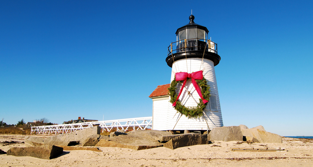 Brant Point Lighthouse decorated with a giant wreath for Christmas.