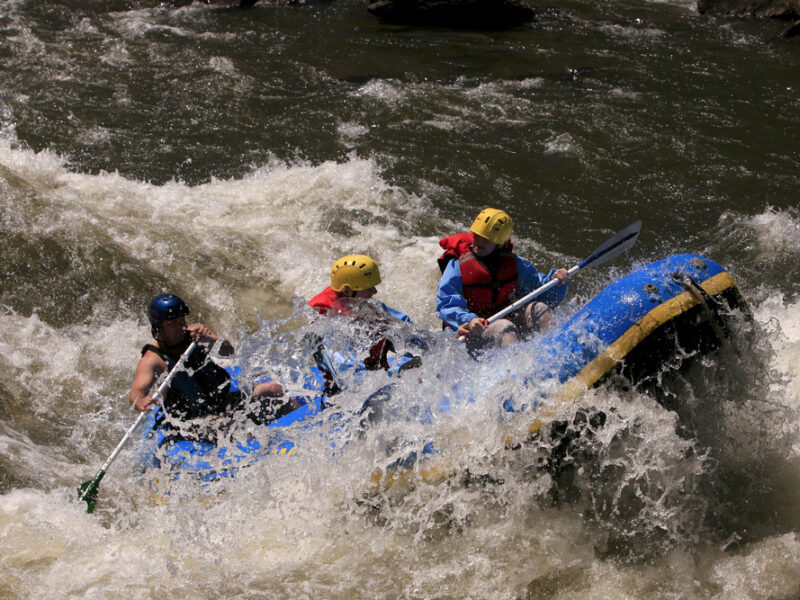 A family rides on a raft through rapids in Tennessee. 