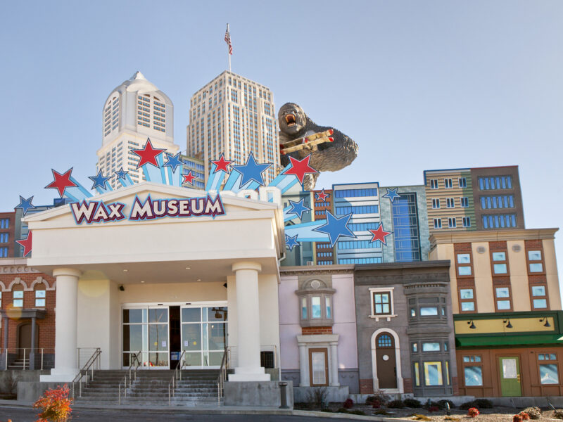 A towering wax figure of King Kong clings to the siding of The Wax Museum building in Pigeon Forge. The museum is designed to look like a city skyline.