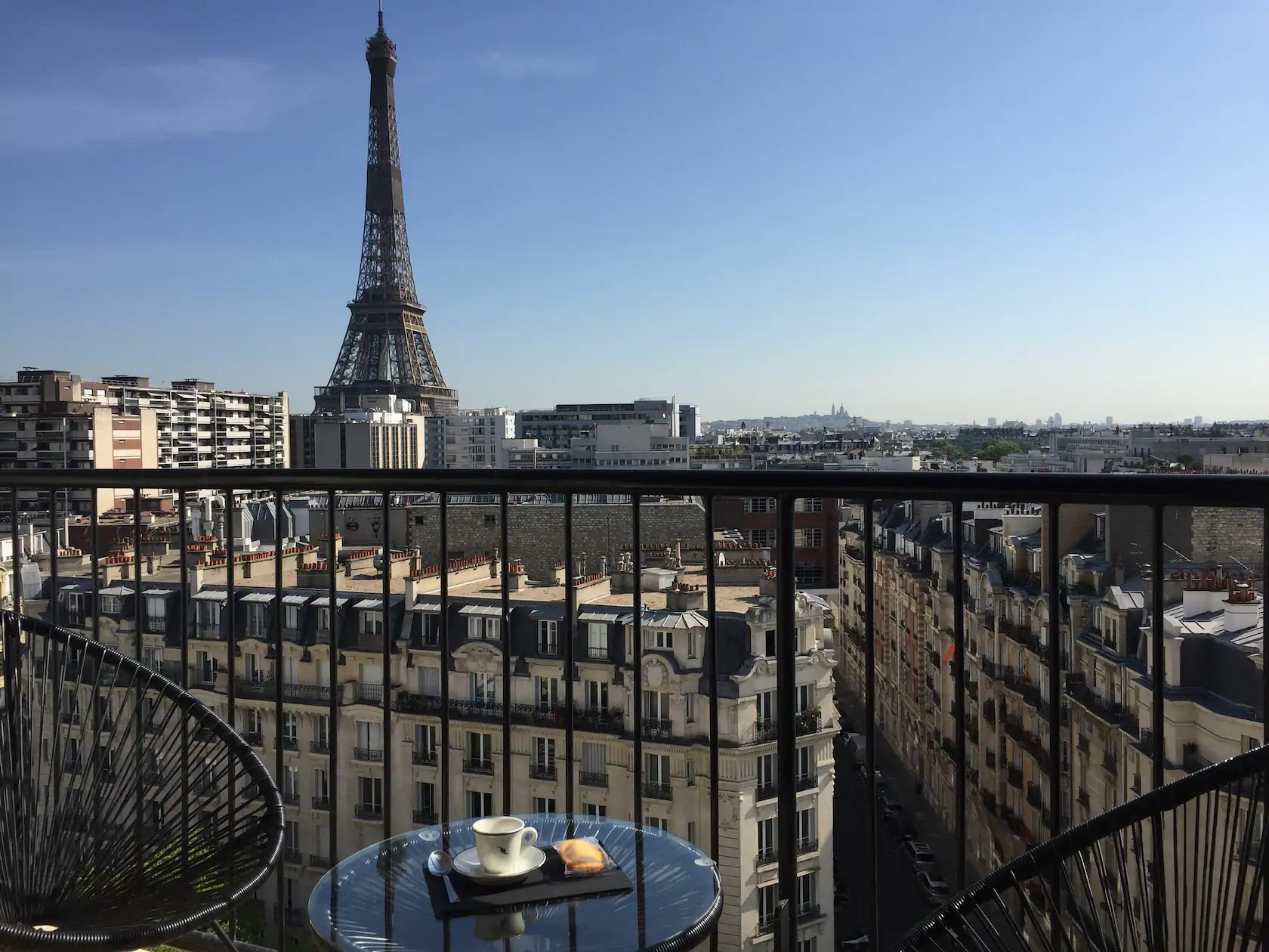 Photo of private balcony with view of the Eiffel Tower at the Eiffel Tower Luxury Flat Airbnb in Paris.