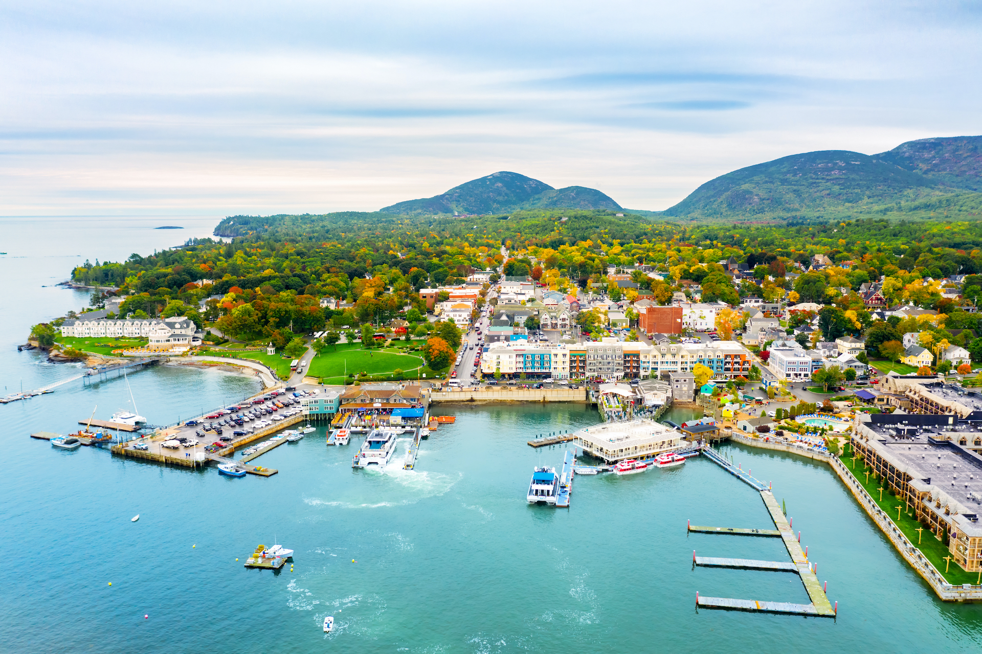 aerial view of teal waters and colorful buildings of Bar Harbor, Maine