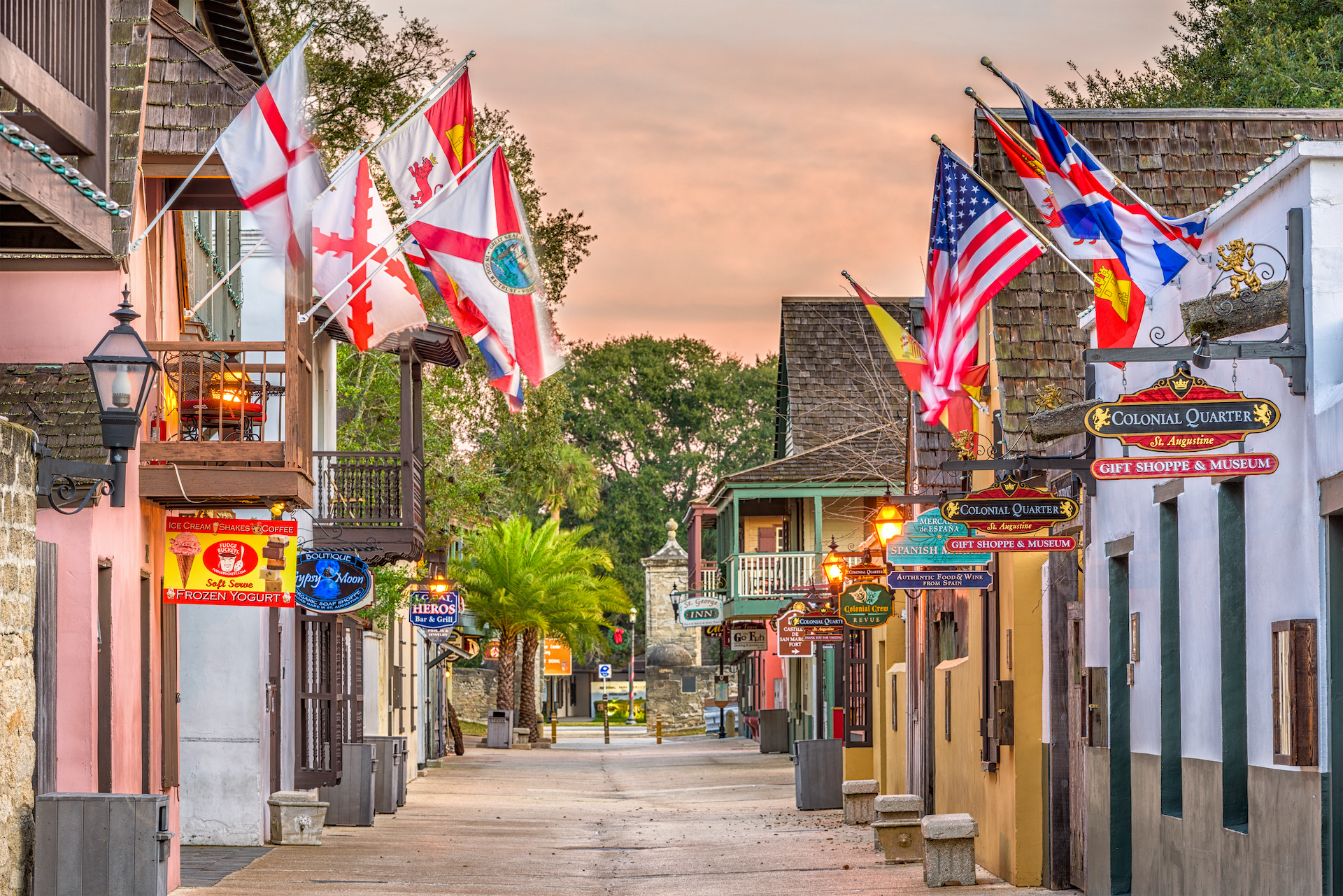 international flags lining small st. augustine street small towns in America