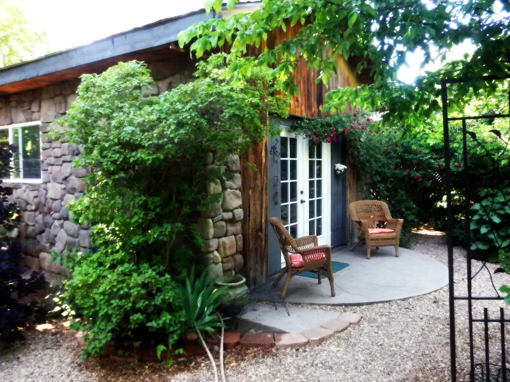 a beautiful cottage with double door and greenery, one of the best Airbnbs in Utah