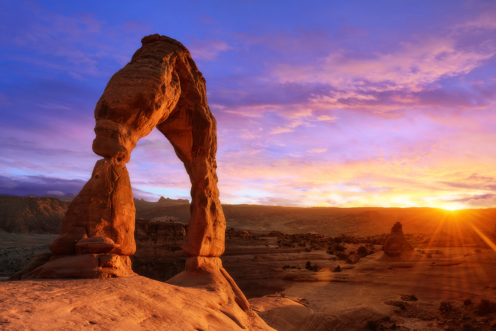A beautiful sunset in Utah in article talking about airbnb in Utah