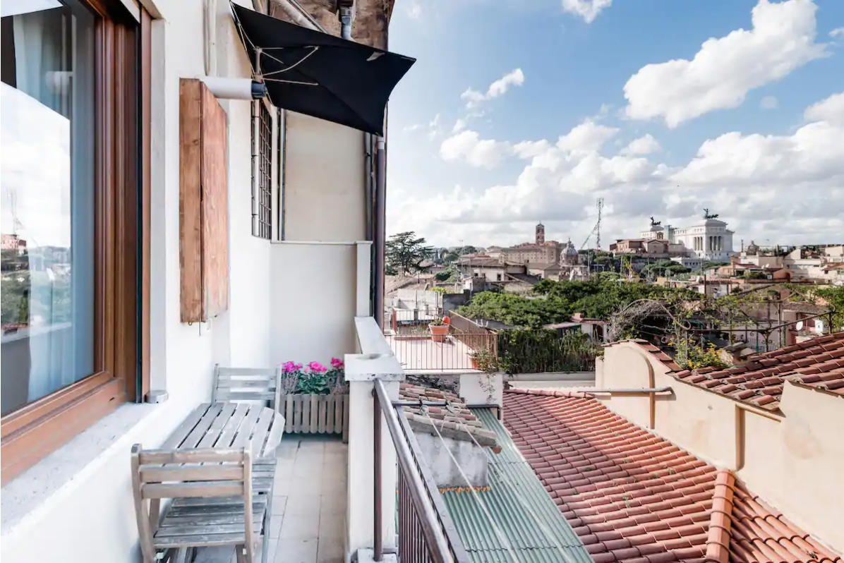 this airbnb in rome has stunning views of the rooftops of rome