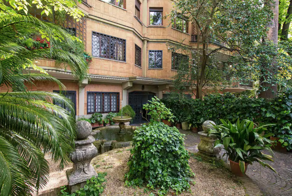 the exterior of this airbnb in rome looks like the setting of a rom com movie!