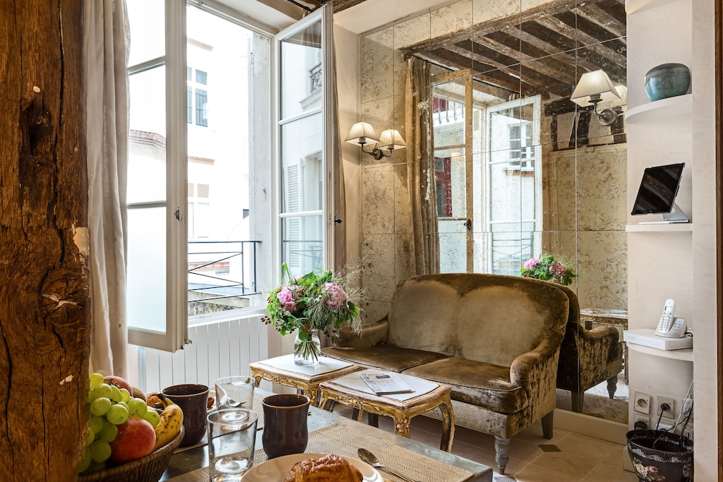 view of the antique couch in the living room of this St. Germain studio