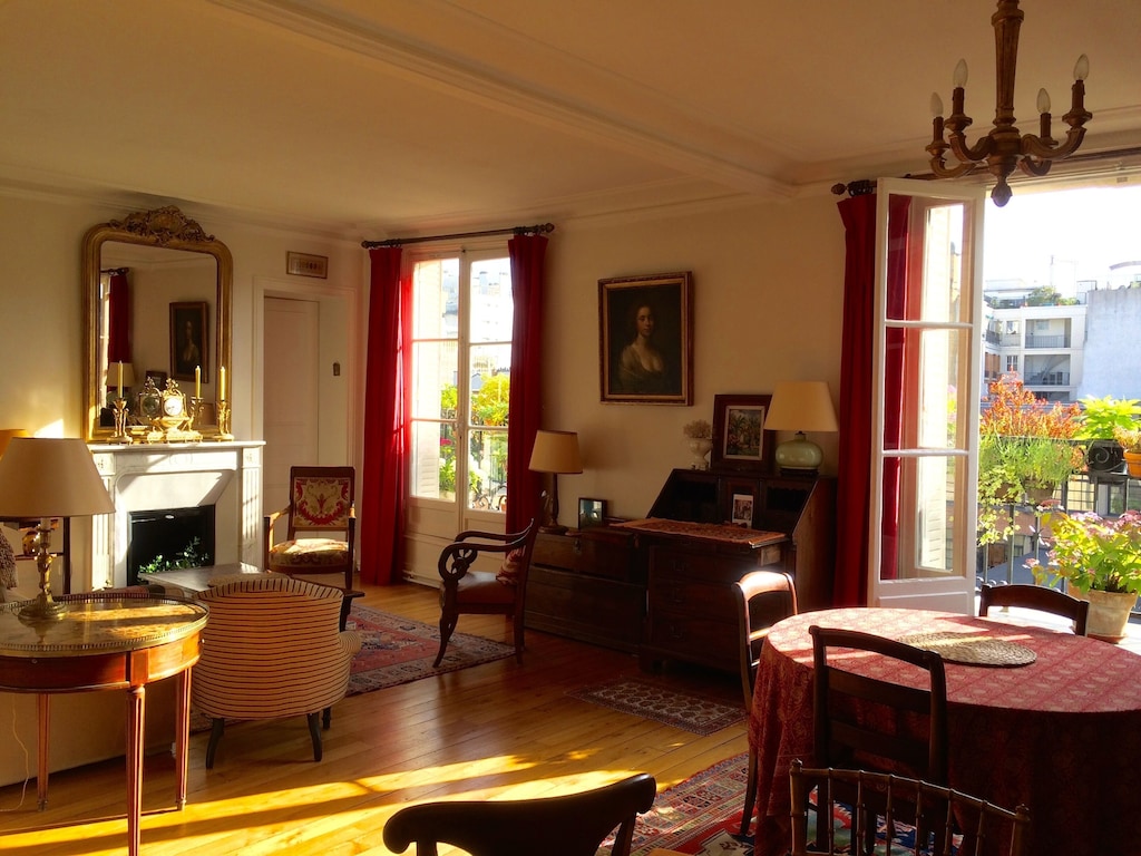 view of the vintage style living room of this apartment in paris