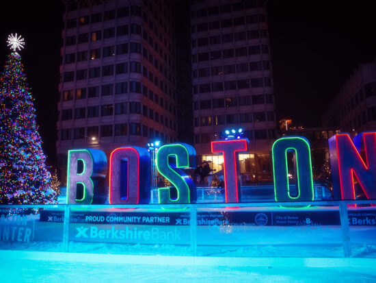 Photo of an outdoor ice rink in Boston during Christmastime.