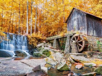 Photo of a historic mill and a waterfall in Marietta Georgia, one of the best places to experience Fall in Georgia.