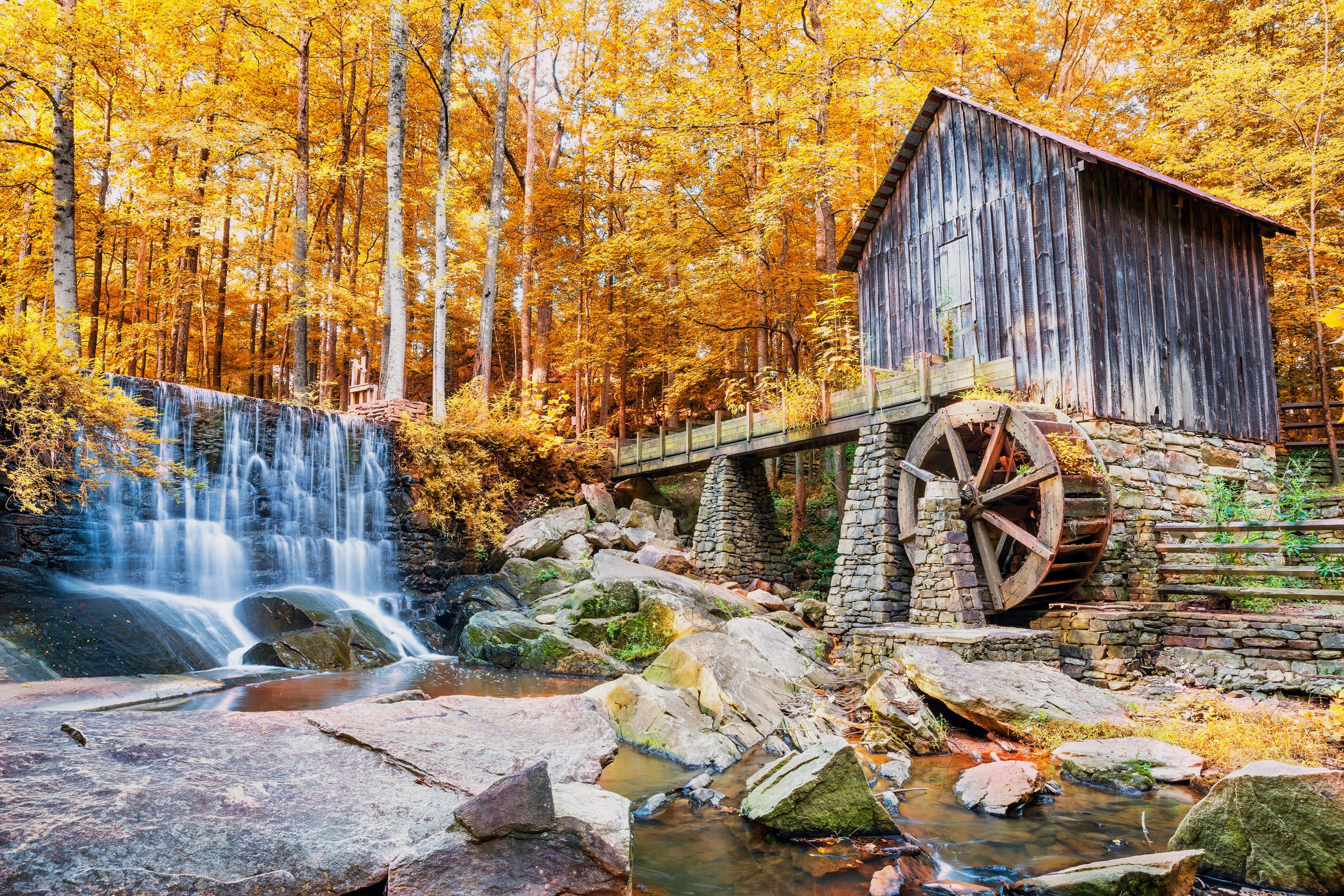 Photo of a historic mill and a waterfall in Marietta Georgia, one of the best places to experience Fall in Georgia.