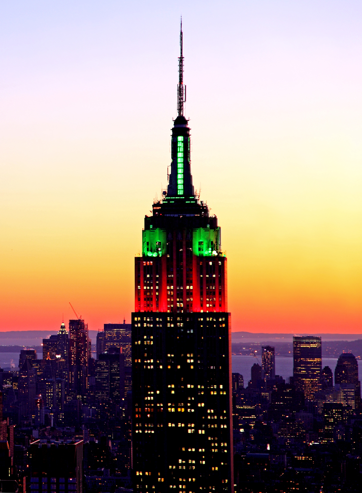 the Empire State Building illuminated in the seasonal Christmas holiday colors of red and green