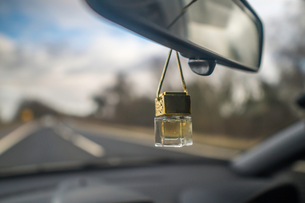 An airfreshner on a mirror