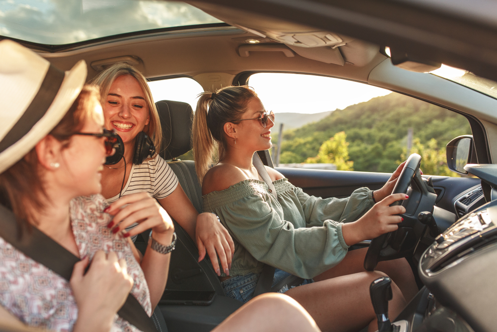 Friends gather and drive in a car