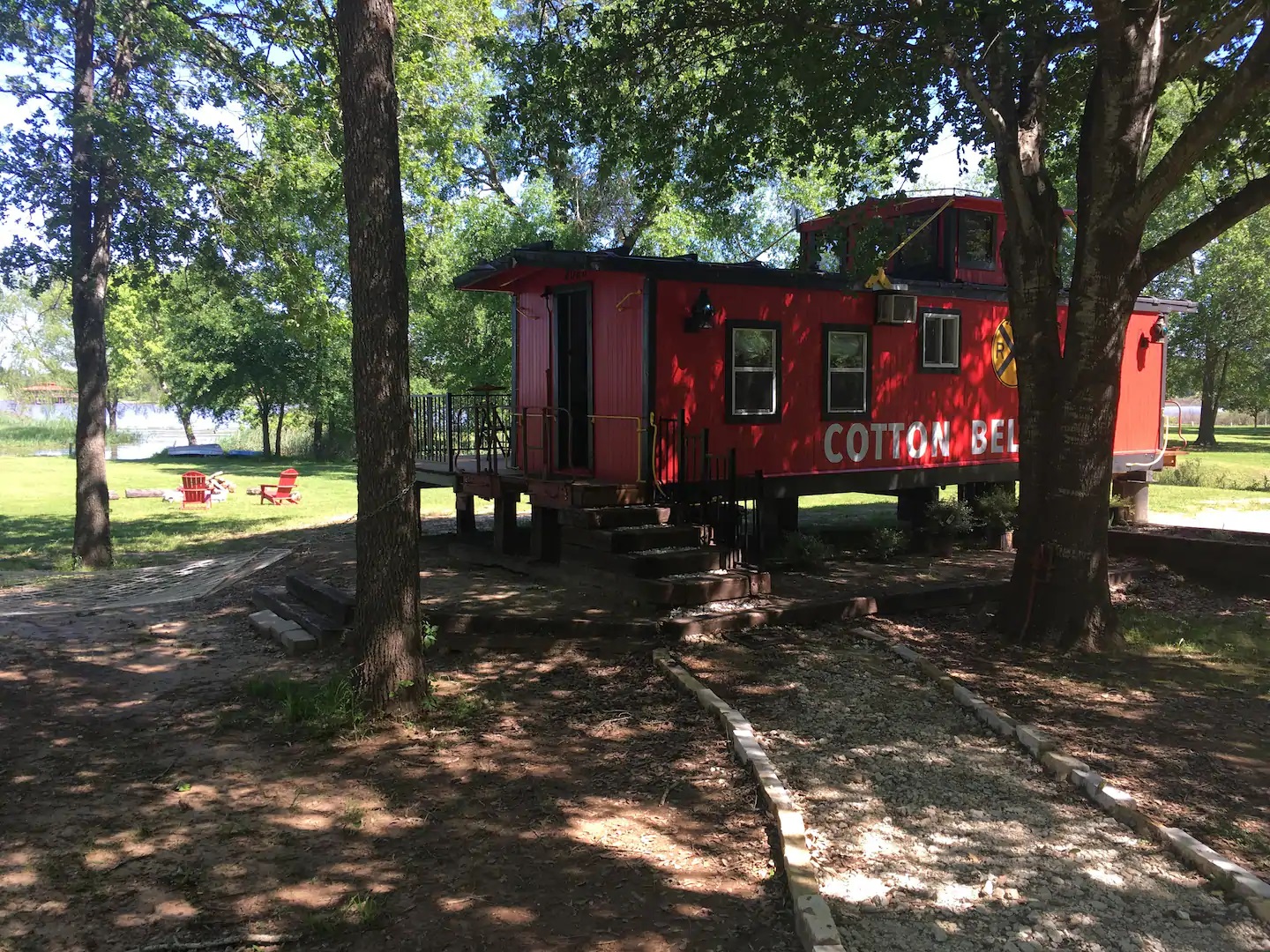 Photo of a bright red 1920's vintage caboose VRBO.