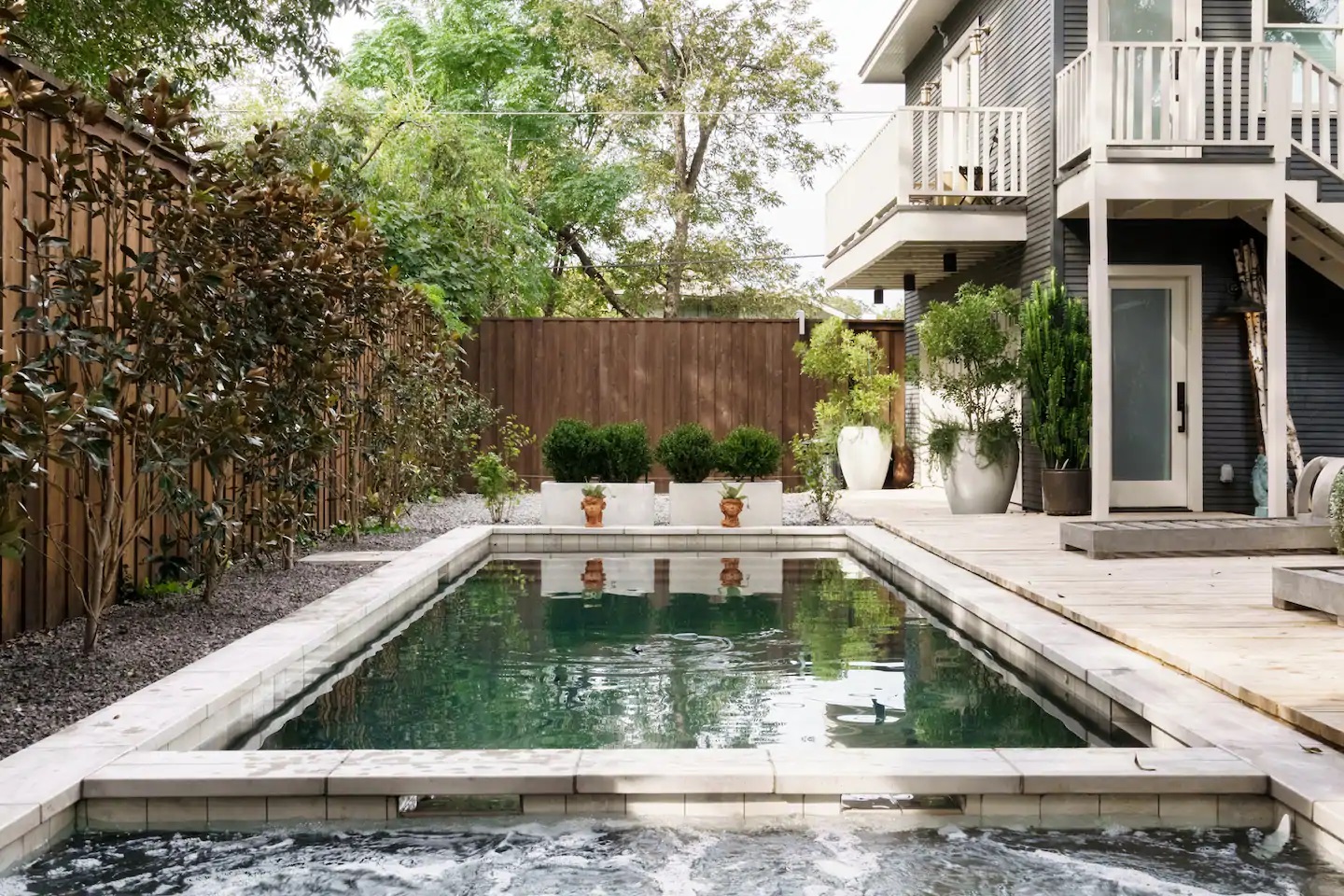 Photo of the pool and back exterior of an Airbnb in Dallas. 