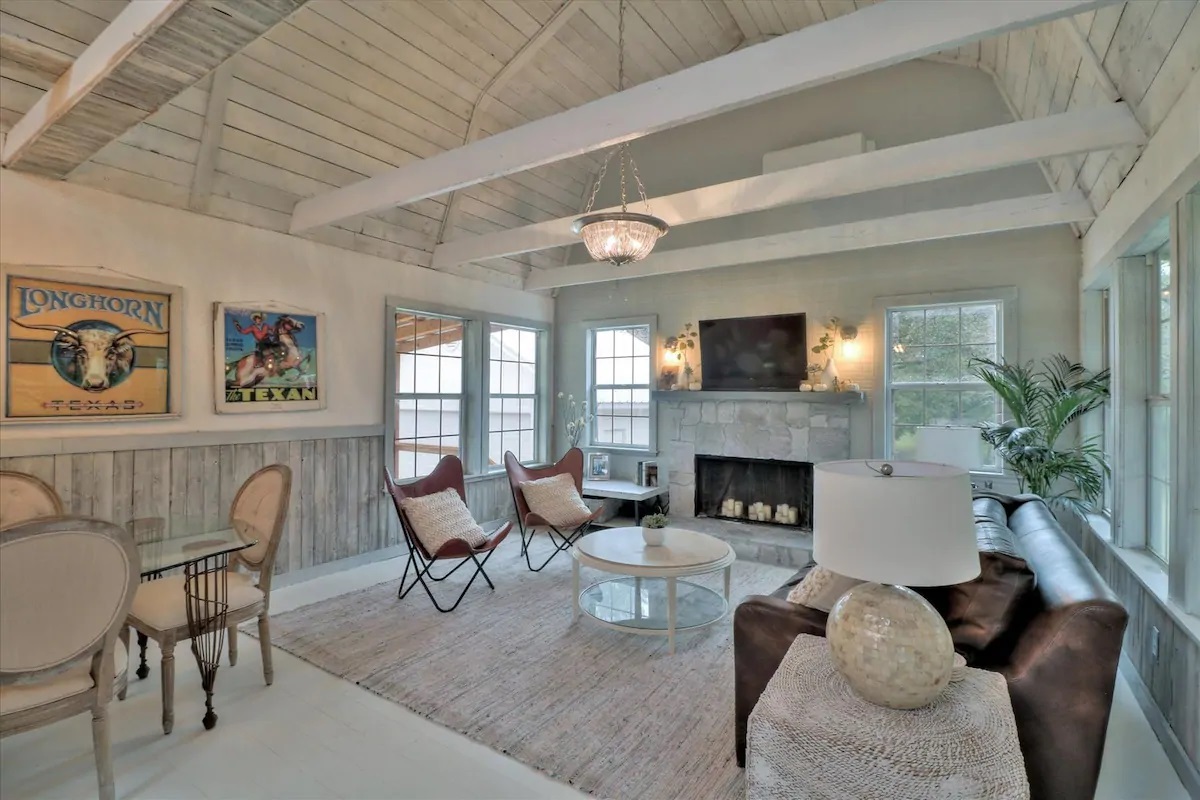 Photo of the living with fireplace at The Pecan Tree House Airbnb in Blanco. 