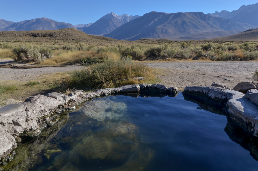 A bright midday view of Whitmore Hot Springs, one of the best natural California hot springs