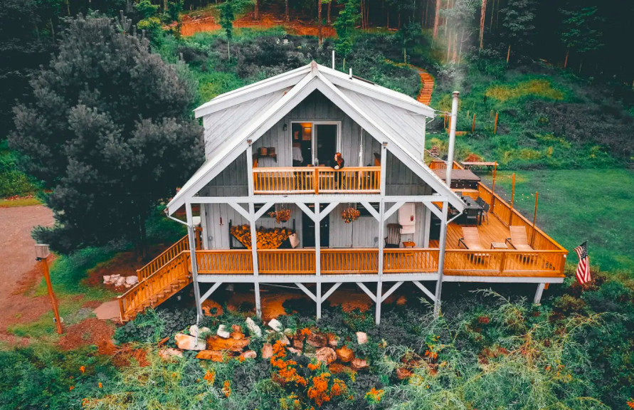 aerial view of three story warm brown and light gray home cabins in the USA