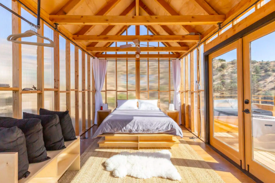 interior of room with wooden frame and completely clear walls cabins in the USA