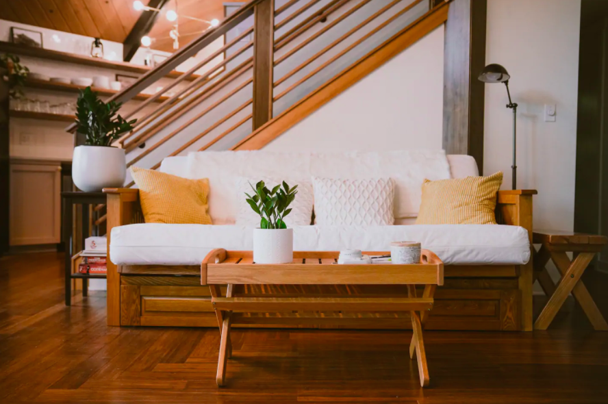 pristine white couch with pale colorful pillows