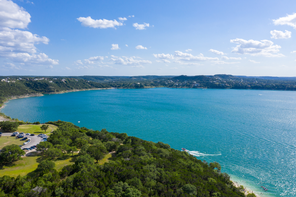 aerial view of teal lake