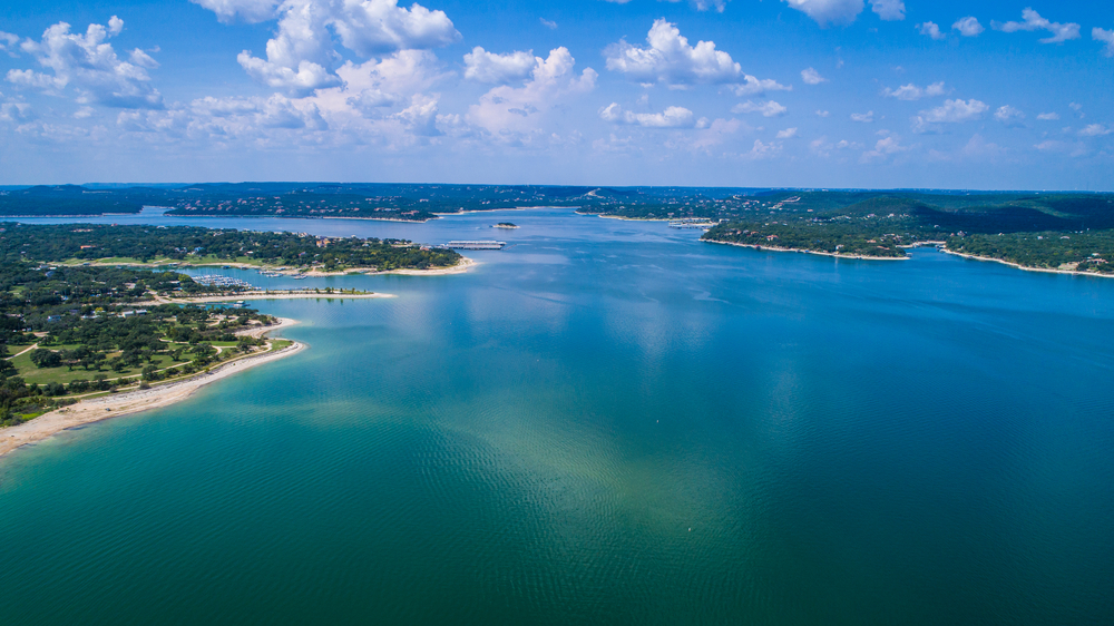 aerial view of blue lake Travis and greenery surrounding it
