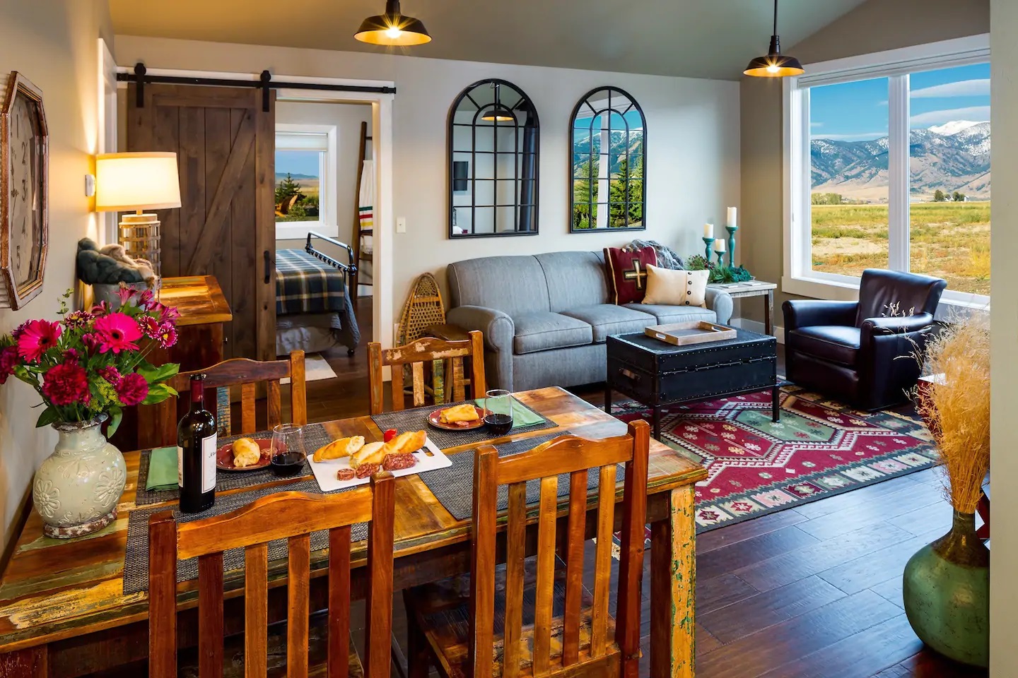 Photo of a living room and dining table inside an Airbnb located in Belgrade, Montana.