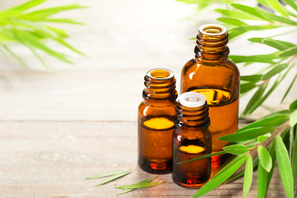 Tea tree oil on a table with a white background. 