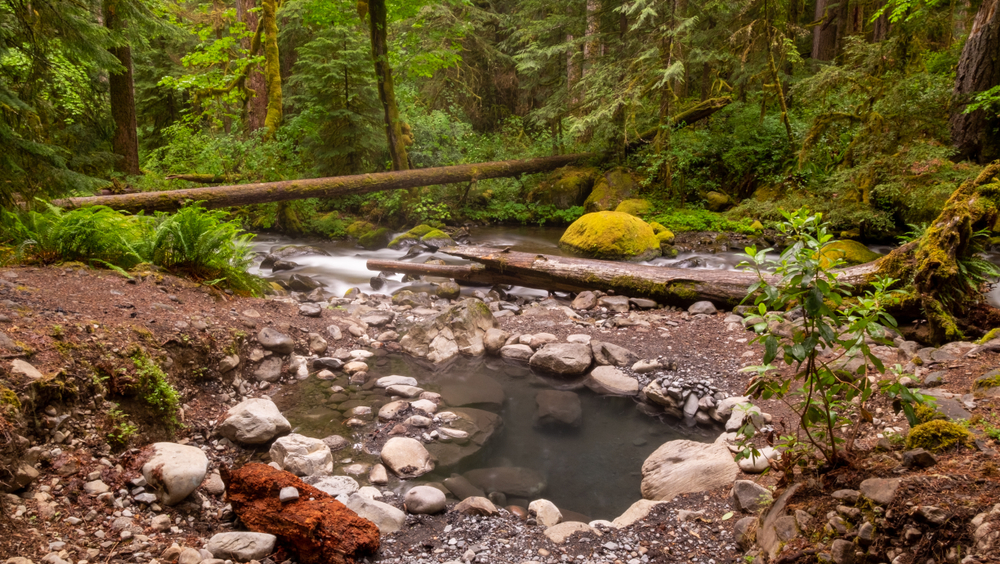 Wall Creek is located on rocky banks and is beautiful for a soak after a hike.