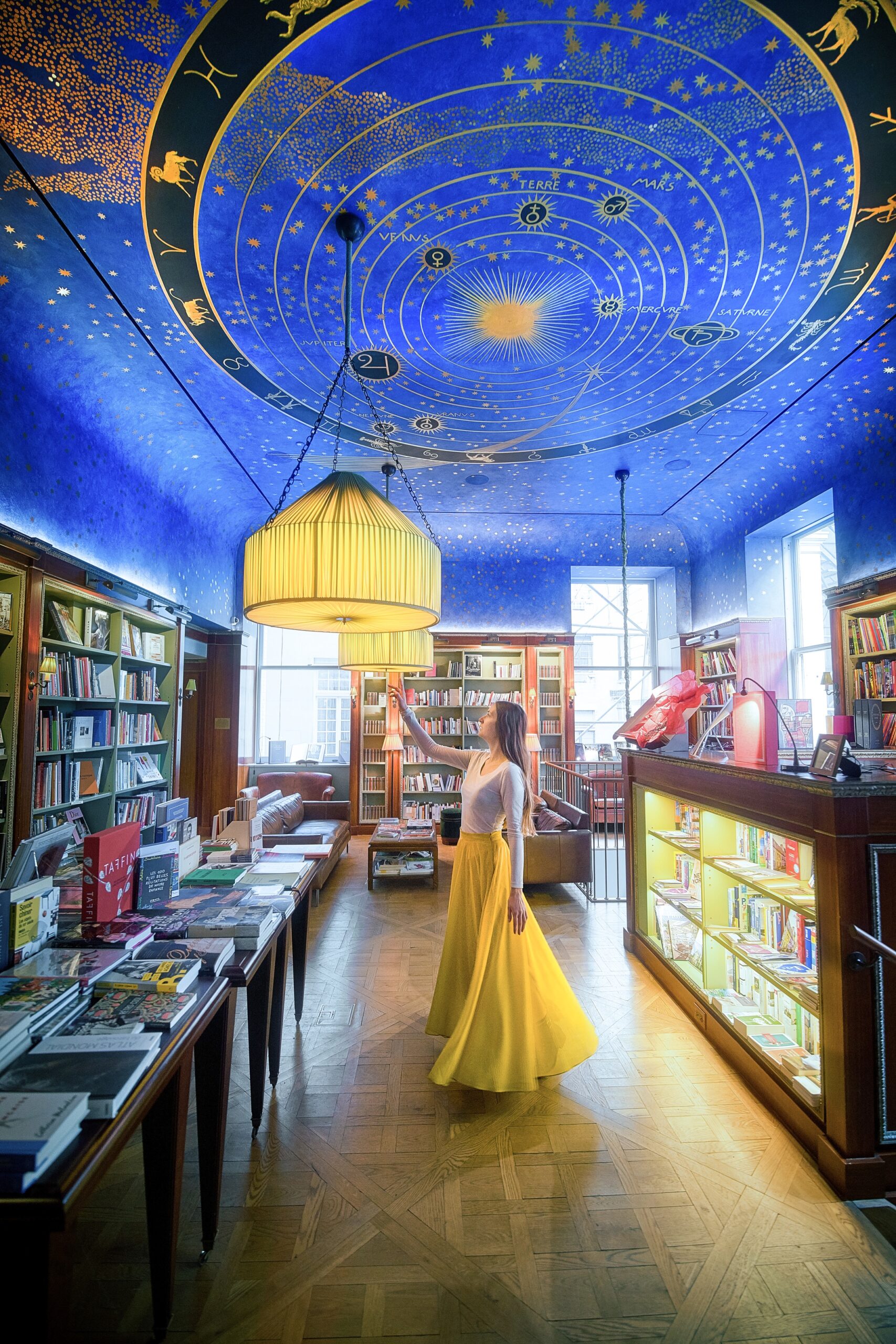 Woman in Albertine books wearing a yellow skirt, one of the most unusual things to do in New York