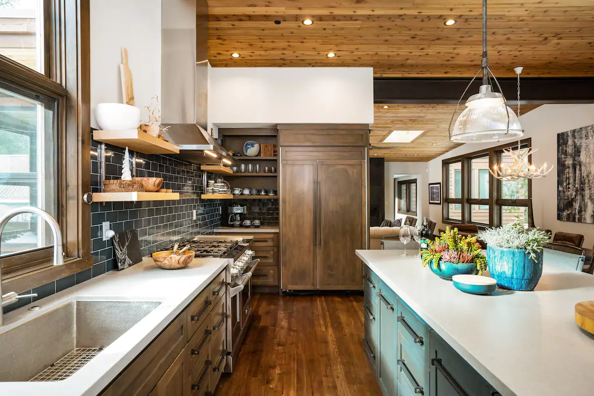 Gorgeous mountain home kitchen, with hard wood floors and ceilings. One of the best California Airbnbs in Lake Tahoe!