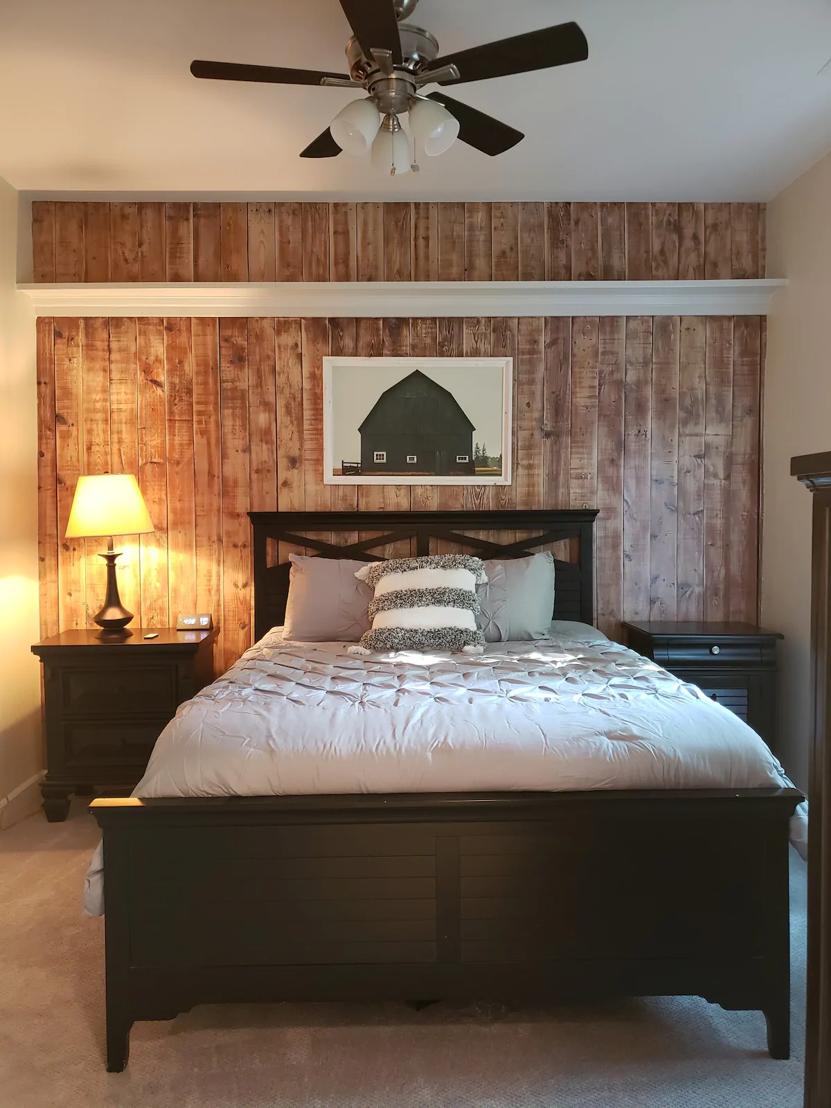 Bedroom with a wood wall in an Airbnb in Nashville