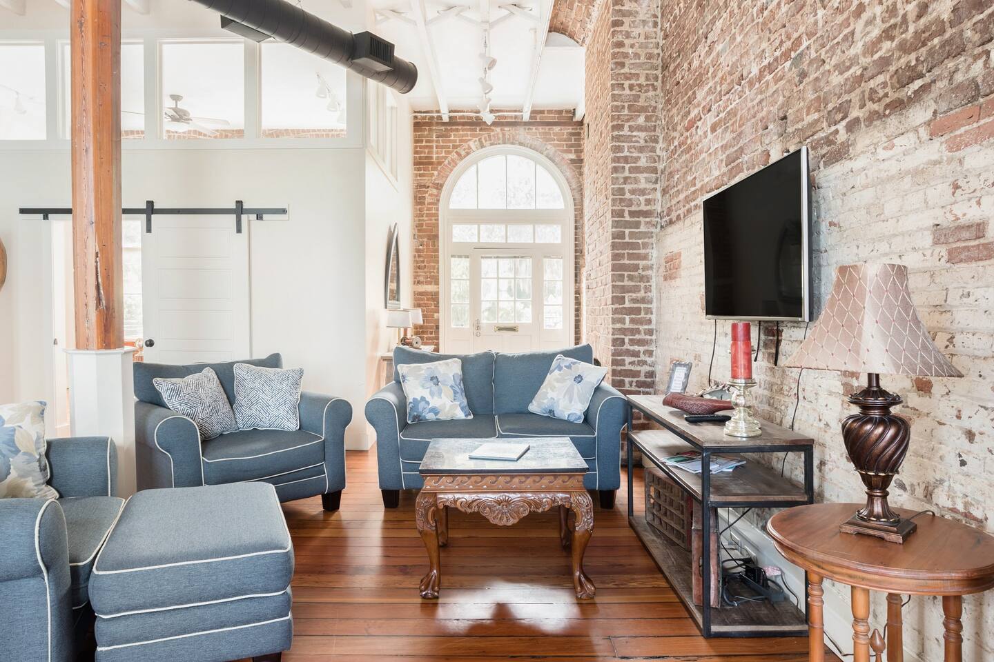 Downtown Riverfront Condo With Industrial Accents and exposed brick walls