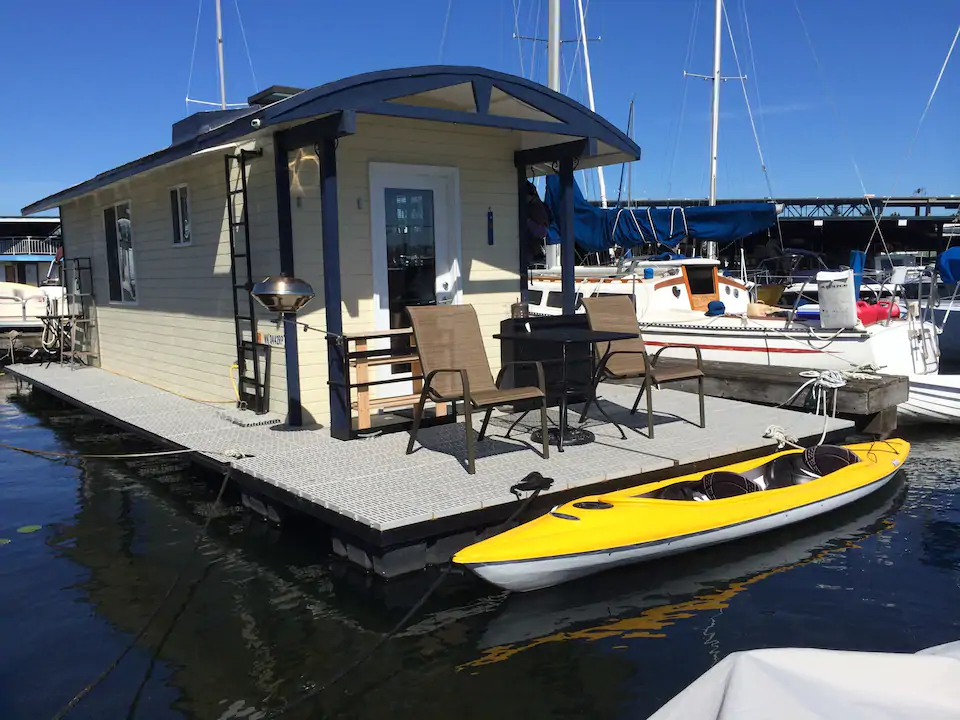 picture of a tugboat with a kayak in front